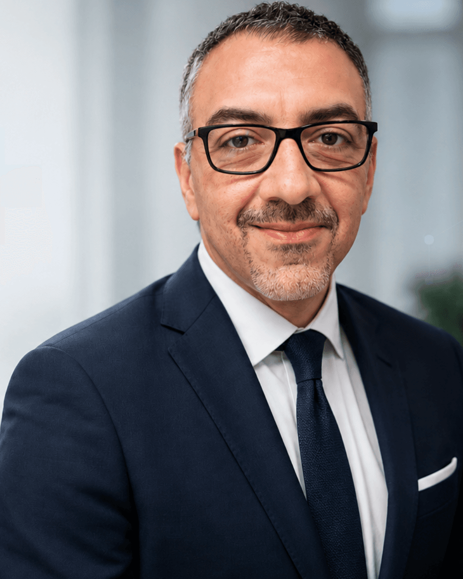 Mr Sherif Elshazly in a dark suit and tie